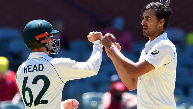 Mitchell Starc celebrates his 248th Test wicket with Travis Head Picture: AFP