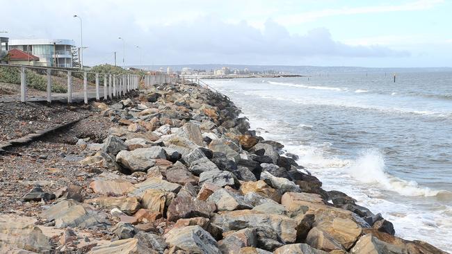 Water right up against the rocks at West Beach in 2016 after stormy weather. Picture: Stephen Laffer