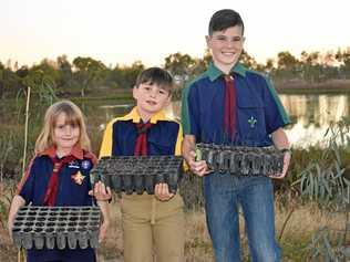 FUTURE PROOFING: Tayla Lee, Renton Silvester and Cooper Regan from Roma Scouts are growing trees for the future of the Roma Bush Gardens. Picture: Ellen Ransley