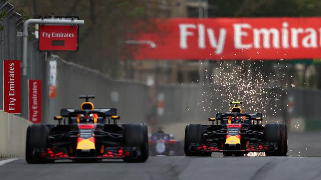 Daniel Ricciardo (L) and then teammate Max Verstappen (R) locked in a head to head battle for first in April 2018 in Baku, Azerbaijan. (Photo by Dan Istitene/Getty Images)