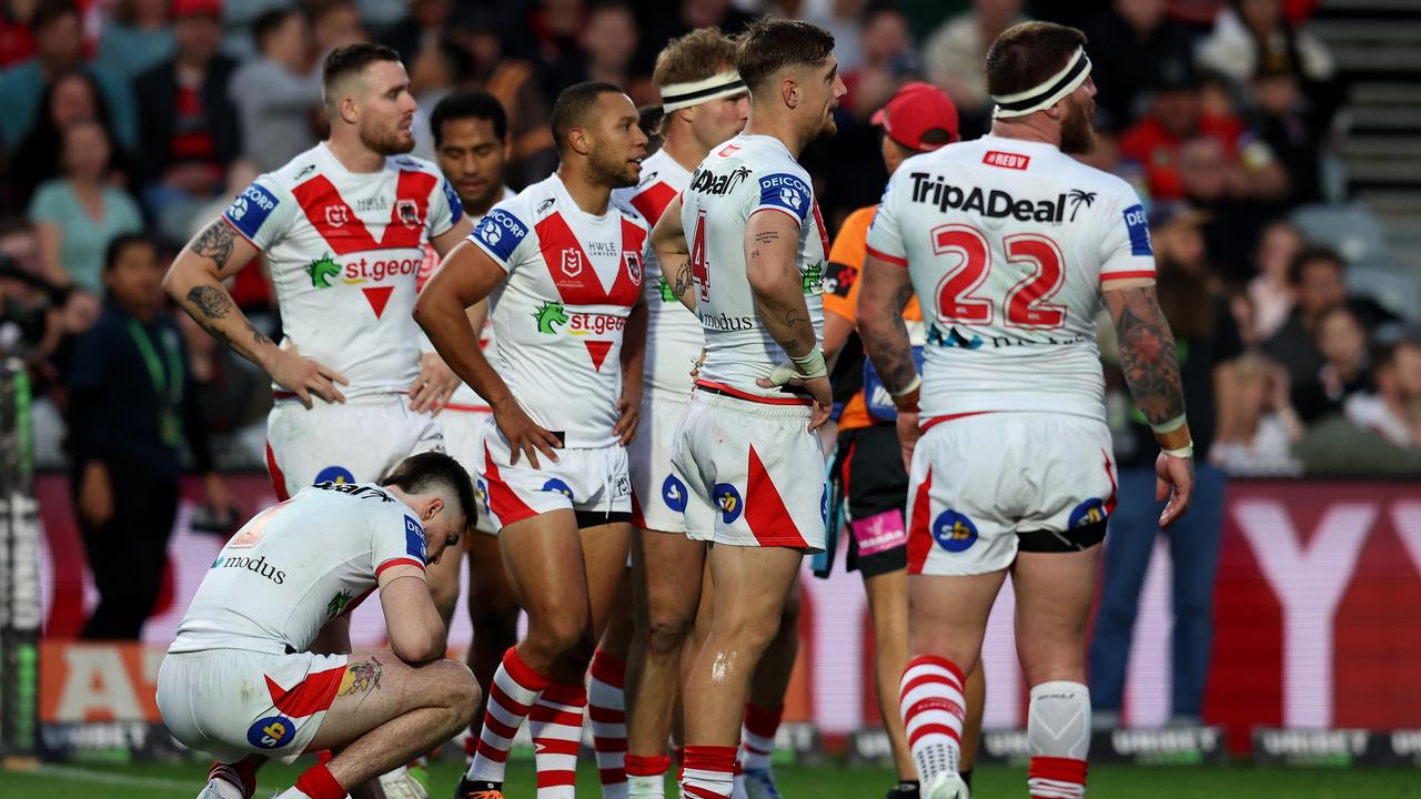GOSFORD, AUSTRALIA - JULY 16: Dragons players huddle together following a Roosters try during the round 18 NRL match between the Sydney Roosters and the St George Illawarra Dragons at Central Coast Stadium, on July 16, 2022, in Gosford, Australia. (Photo by Scott Gardiner/Getty Images)
