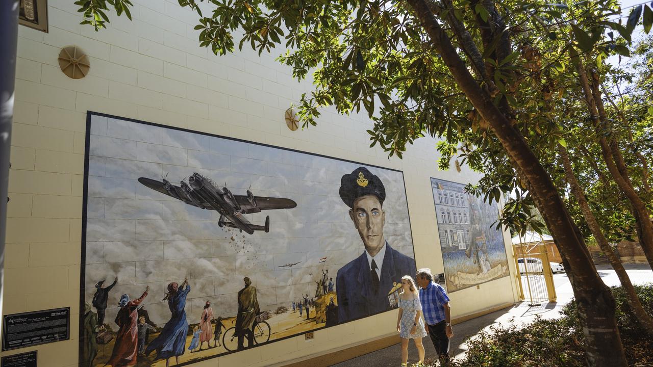 Frank Lawrence mural outside the Military and Colonial Museum. This mural commemorates Squadron Leader Frank Lawrence DFC DFM, RAAF, Maryborough’s most decorated World War II veteran and his flight to drop foodstuffs and other vital supplies to the starving residents of Rotterdam, The Netherlands on 3 May 1945. The artist, Benjamin Higgins, or Mr Mupz as he calls himself, is a member of the Rythmincolour Collective – a Sunshine Coast based group of artists specialising in mural art. credit: Reuben Nutt escape 25 april 2021