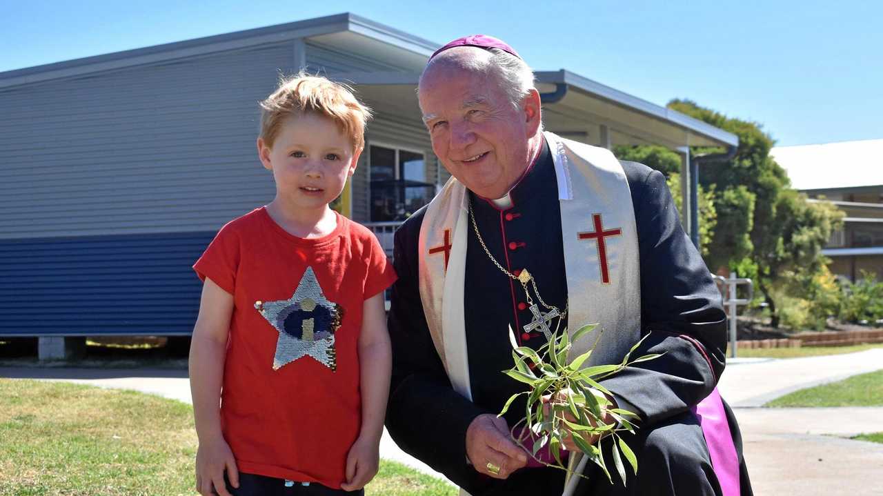 Max Challenor of St. John's Kindy wanted to be the first in his class to meet Bishop Robert McGukin. Picture: Jorja McDonnell