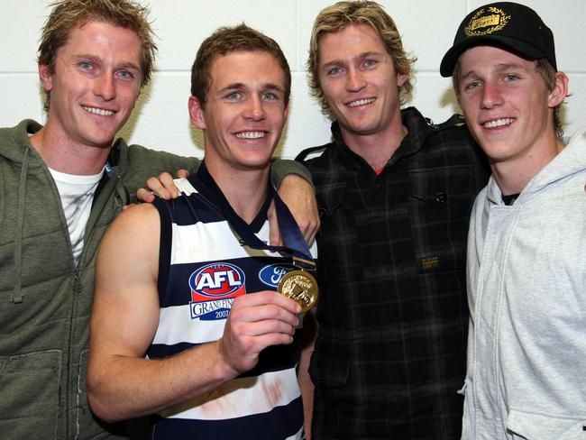 Troy, Adam and Scott Selwood congratulate Joel after the 2007 Grand Final.