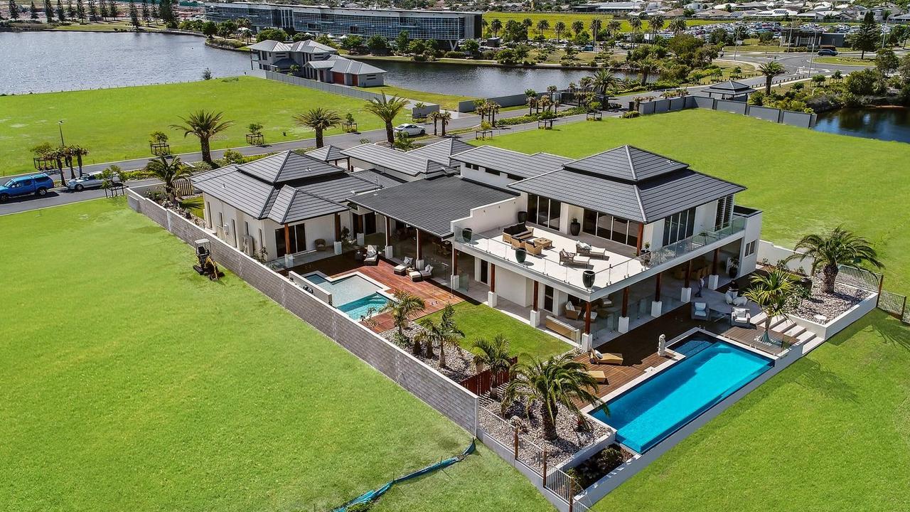 The five-bedroom, five-bathroom home at 5 Entrance Island, Bokarina, which backs onto Lake Kawana, was built in 2017 by its current owners.