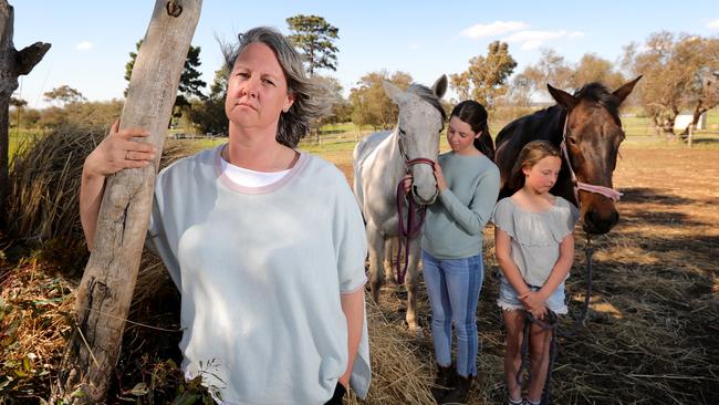 Dimity Hirst with her daughters Bethany and Ruby, who had their five farms in Tasmania sold by the ANZ Bank at below valuation in 2012. Picture: Stuart McEvoy