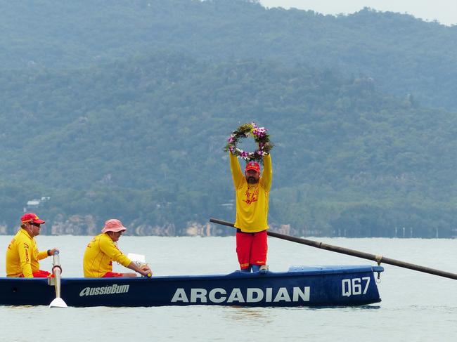 Members of the Arcadian SLSC at Net 1, The Strand, observe a moment of silence for Surf Life Saving memorial Day. Picture: Blair Jackson.