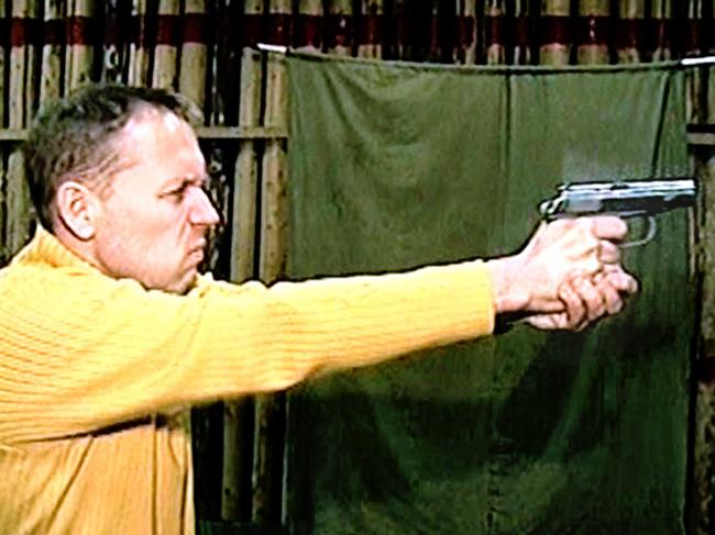 Andrei Lugovoi, a businessmen who was formerly in the Russian security services and reported by British media to be a suspect in the radiation poisoning murder of former security agent Alexander Litvinenko, fires a pistol at a shooting gallery somewhere in undisclosed location in Russia, in undated image from the television broadcast on NTV Russian Channel.  TV