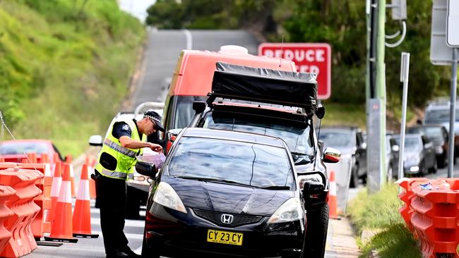 The State Government has now sent military personnel to reinforce police at border checkpoints, and at least one dose of the vaccine will be mandatory for all interstate essential workers from Friday. Picture: NCA NewsWire / Dan Peled