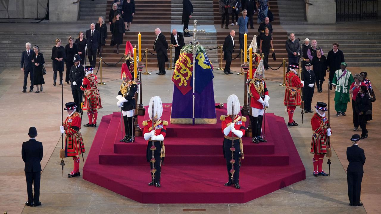 Queen Elizabeth II funeral: Silent mourners queue for hours to pay ...