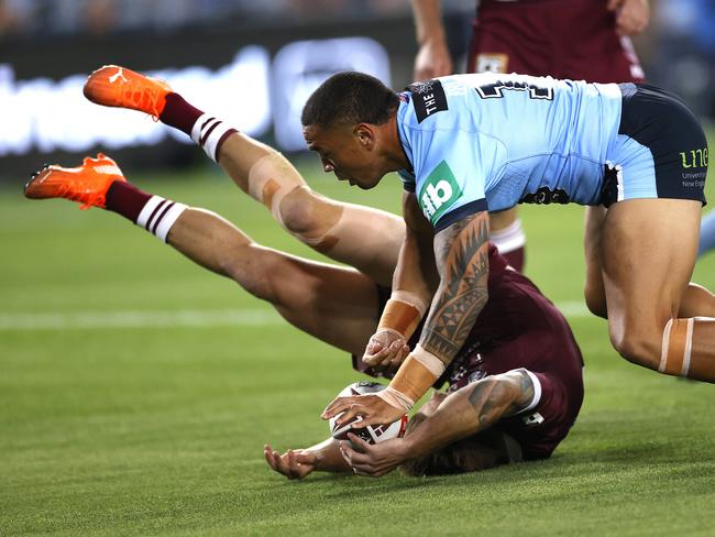 Cameron Munster’s head whacks into the ANZ Stadium turf after attempting to defuse a bomb. Picture: Phil Hillyard