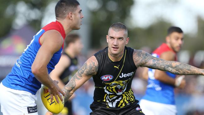 Richmond star Dustin Martin keeps a close eye on Melbourne’s Christian Petracca. Picture: Michael Klein