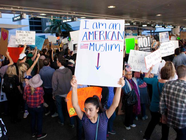 Protesters gather at the Los Angeles International airport's Tom Bradley terminal to demonstrate against President Trump's executive order. Picture: AFP/Konrad Fiedler