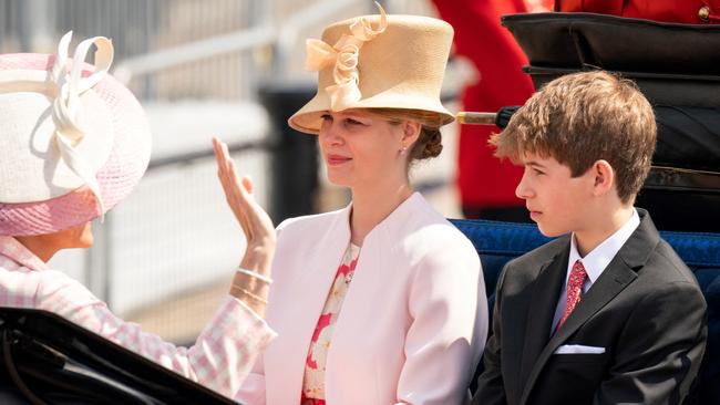 Sophie, Countess of Wessex (L), Lady Louise Windsor (C) and James, Viscount Severn travel in a horse-drawn carriage. Picture: AFP