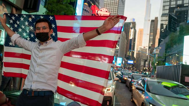People celebrate in the streets in Times Square on November 7. Picture: David Dee Delgado/Getty Images