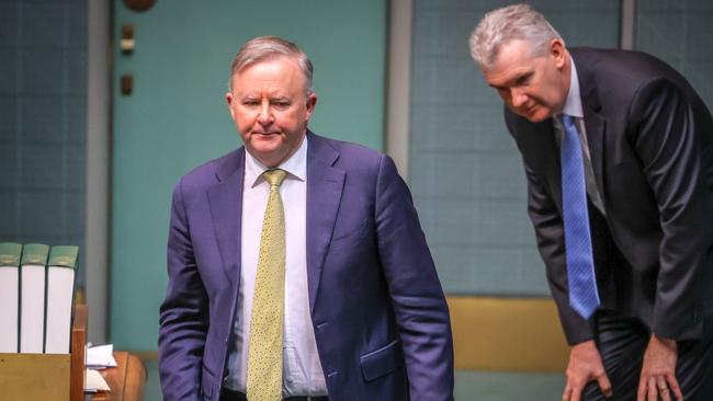 Leader of the Opposition Anthony Albanese walks past Tony Burke during Question Time in the House of Representatives at Parliament House on September 3. Picture: Getty Images