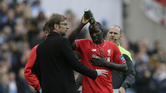 Liverpool's Mamadou Sakho (R).