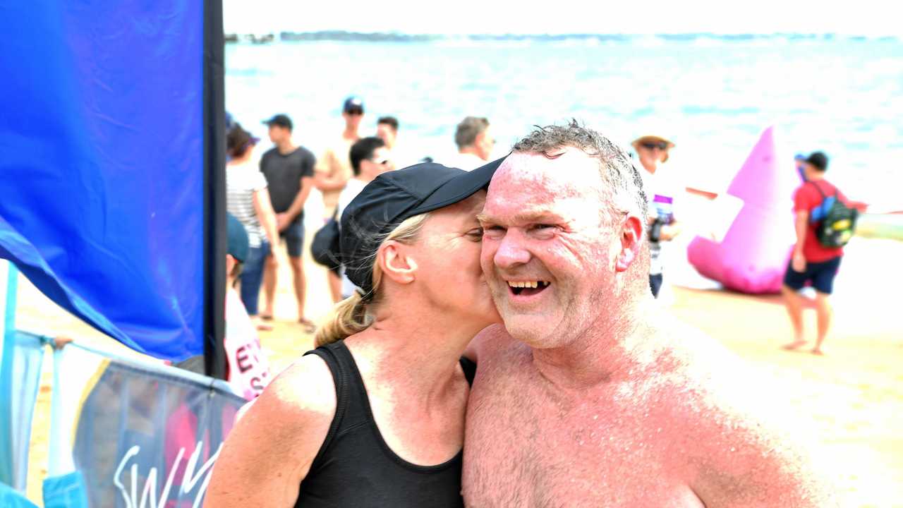 Darren Smith congratulated by wife Kerry after completing the 5km swim in the Enzos open swim classic. Picture: Brendan Bowers