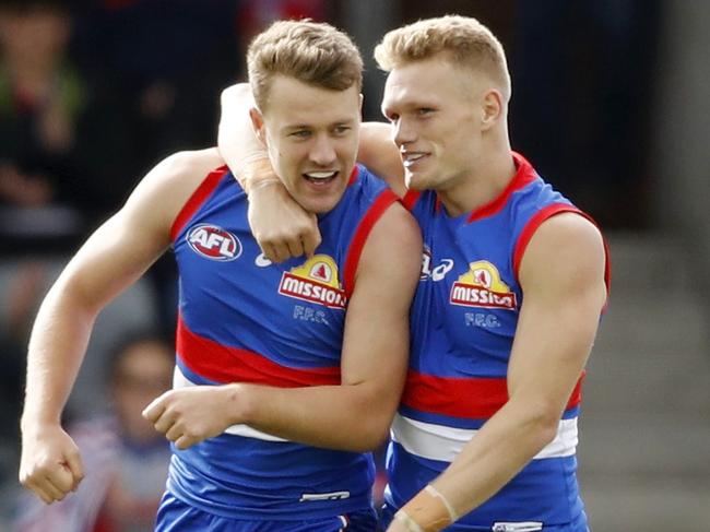 BALLARAT, AUSTRALIA - APRIL 10: Jack Macrae of the Bulldogs celebrates a goal with Adam Treloar during the 2021 AFL Round 04 match between the Western Bulldogs and the Brisbane Lions at Mars Stadium on April 10, 2021 in Ballarat, Australia. (Photo by Dylan Burns/AFL Photos via Getty Images)