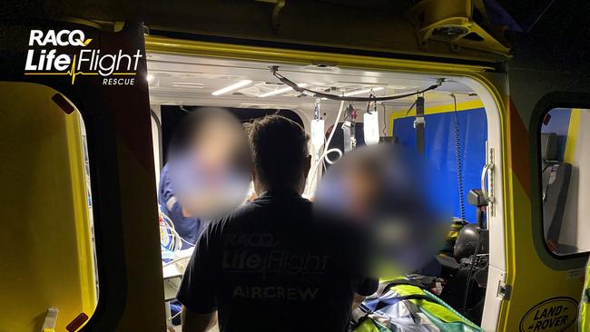 RACQ LifeFlight workers treat an accident victim from Sunday night’s Wolvi crash. Picture: RACQ LifeFlight