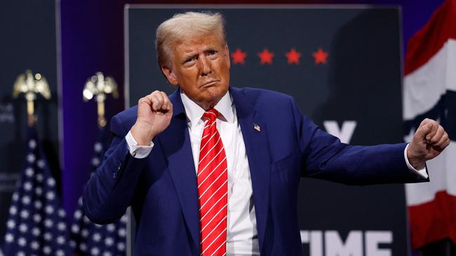 Republican presidential nominee and former US President Donald Trump dances during a campaign rally. Picture: Getty Images