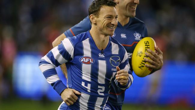 Brent Harvey warms up in long sleeves in honour of Michael Tuck. Picture: Wayne Ludbey