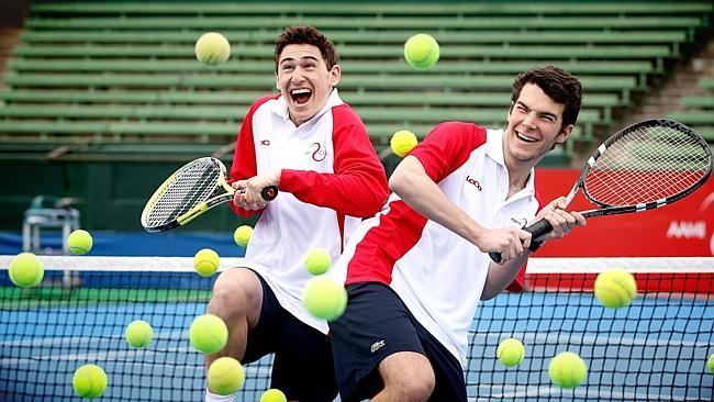 Ball boys Brandon Bassin and Michael Gruber muck about at the Kooyong Lawn Tennis Club. Picture: Hamish Blair 