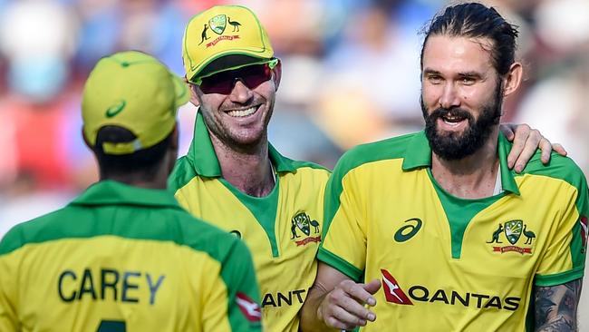 Kane Richardson celebrates with teammates Adam Carey and Ashton Turner after dismissing Ravindra Jadeja during the recent one-day series against India Picture: AFP