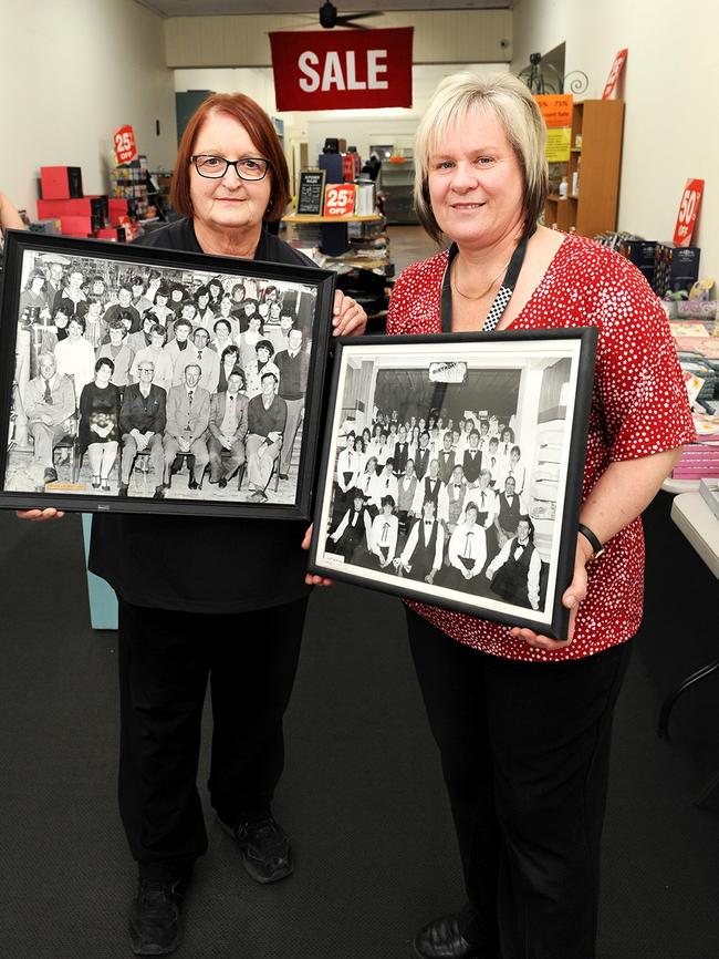 Annette McMahon and Helen Grace hold old staff photos from the early days of Prests. Picture: Greg Higgs