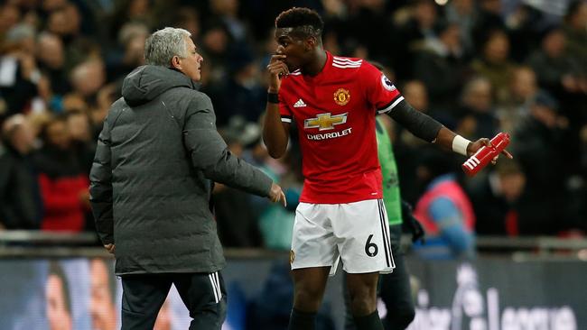 Manchester United's Jose Mourinho talks with Paul Pogba.