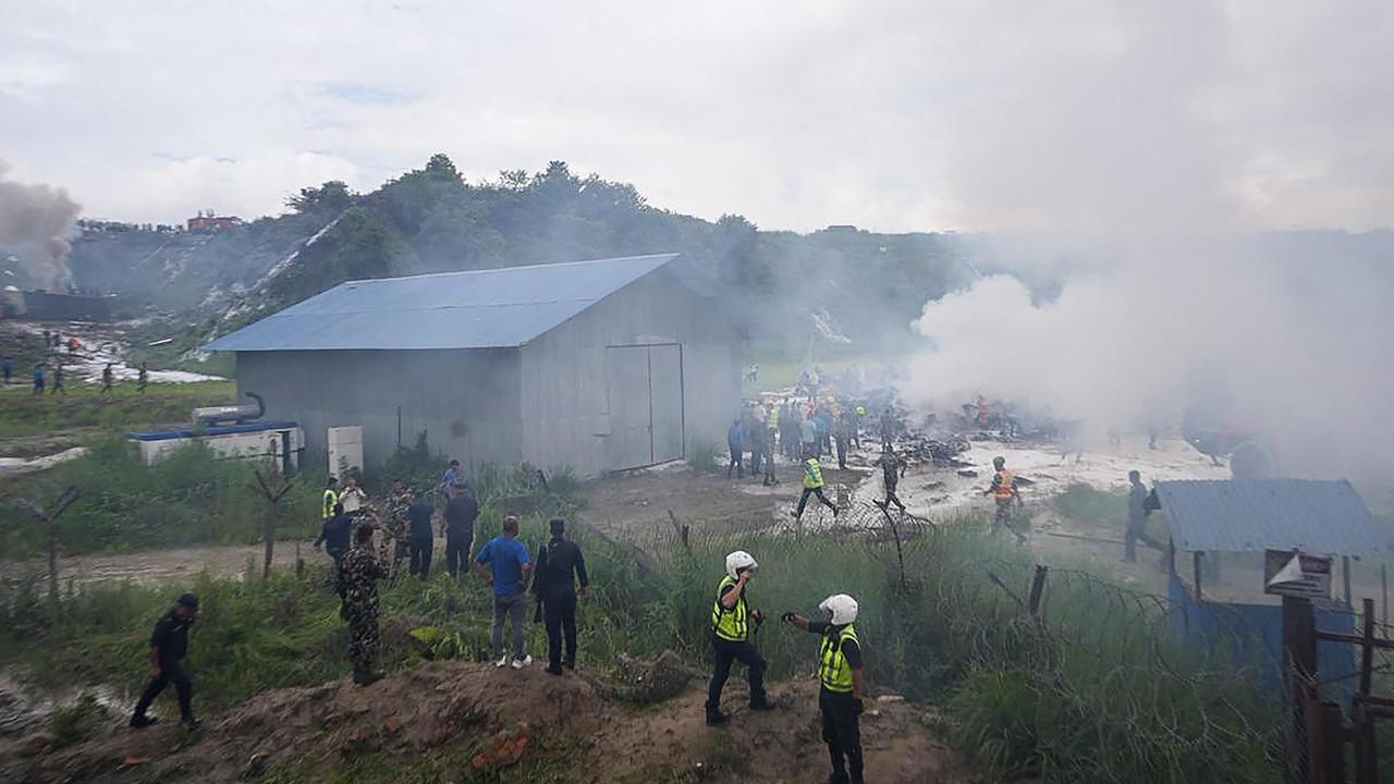 Rescue operations underway at the accident site. Picture: Prabin RANABHAT / AFP)