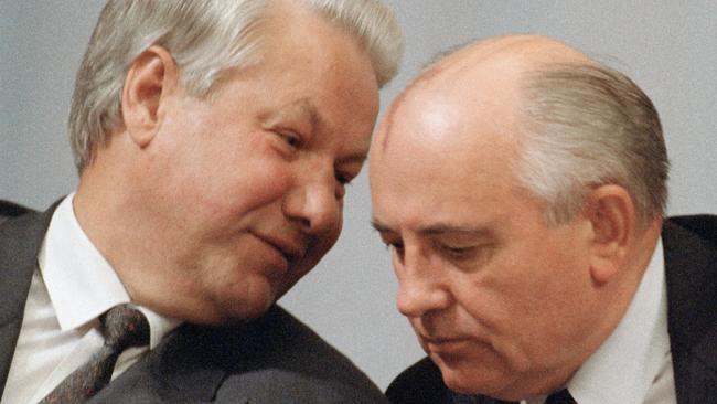 Then Russian President Boris Yeltsin (L) whispering to Soviet President Mikahil Gorbachev during a session of the People's Congress in Moscow, 1991.