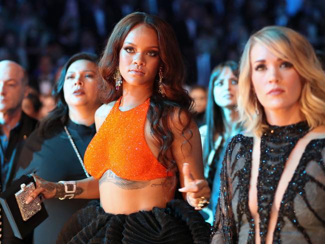 Rihanna and Carrie Underwood during The 59th GRAMMY Awards at STAPLES Center on February 12, 2017 in Los Angeles, California. Picture: Getty