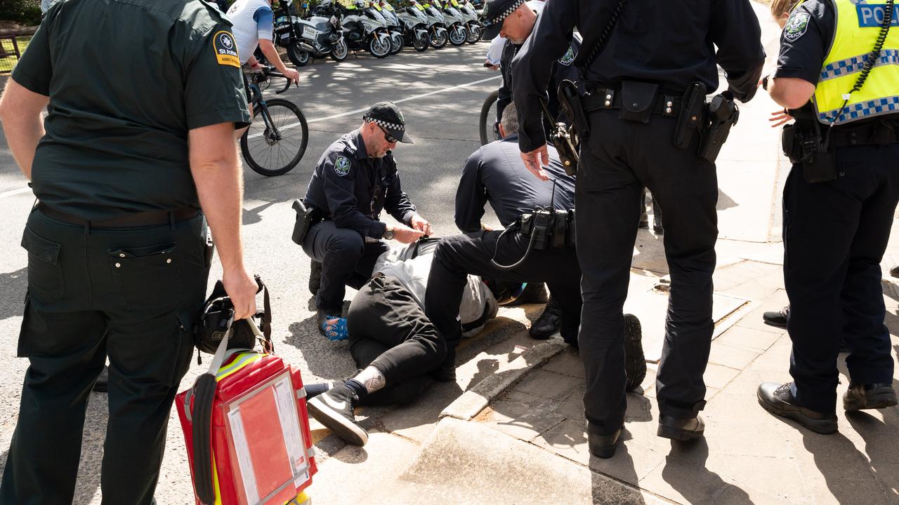 Police attend to the rider after the Tea Tree Gully crash. Picture: Morgan Sette