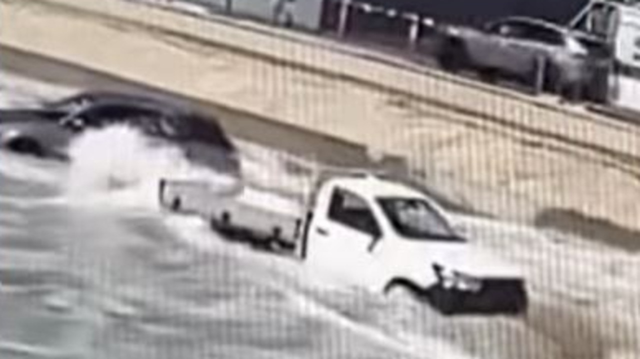 Cars caught in cyclonic swell at surf club