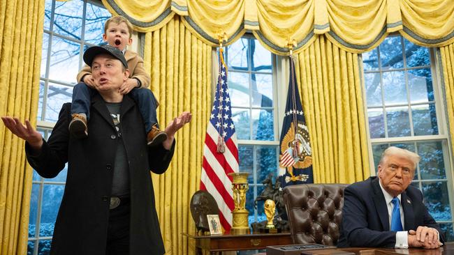 Elon Musk and his son X join Donald Trump as he signs executive orders in the Oval Office. Picture: AFP.