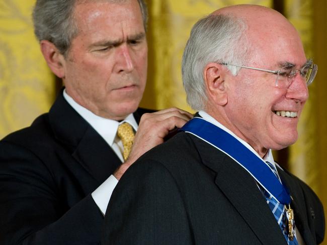 George W. Bush presents the Presidential Medal of Freedom to John Howard in Washington in 2009. Picture: AFP