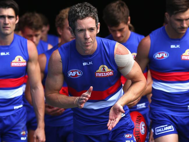 MELBOURNE, AUSTRALIA - MARCH 27: Robert Murphy of the Bulldogs leads his team out onto the field during the round one AFL match between the Western Bulldogs and the Fremantle Dockers at Etihad Stadium on March 27, 2016 in Melbourne, Australia. (Photo by Quinn Rooney/Getty Images)