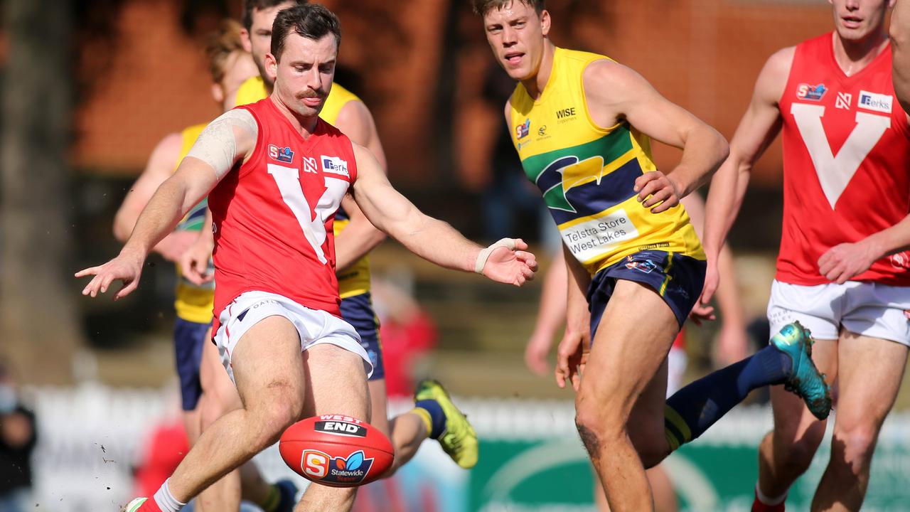 Alex Spina gets a kick away while playing for North Adelaide. Picture: Dean Martin