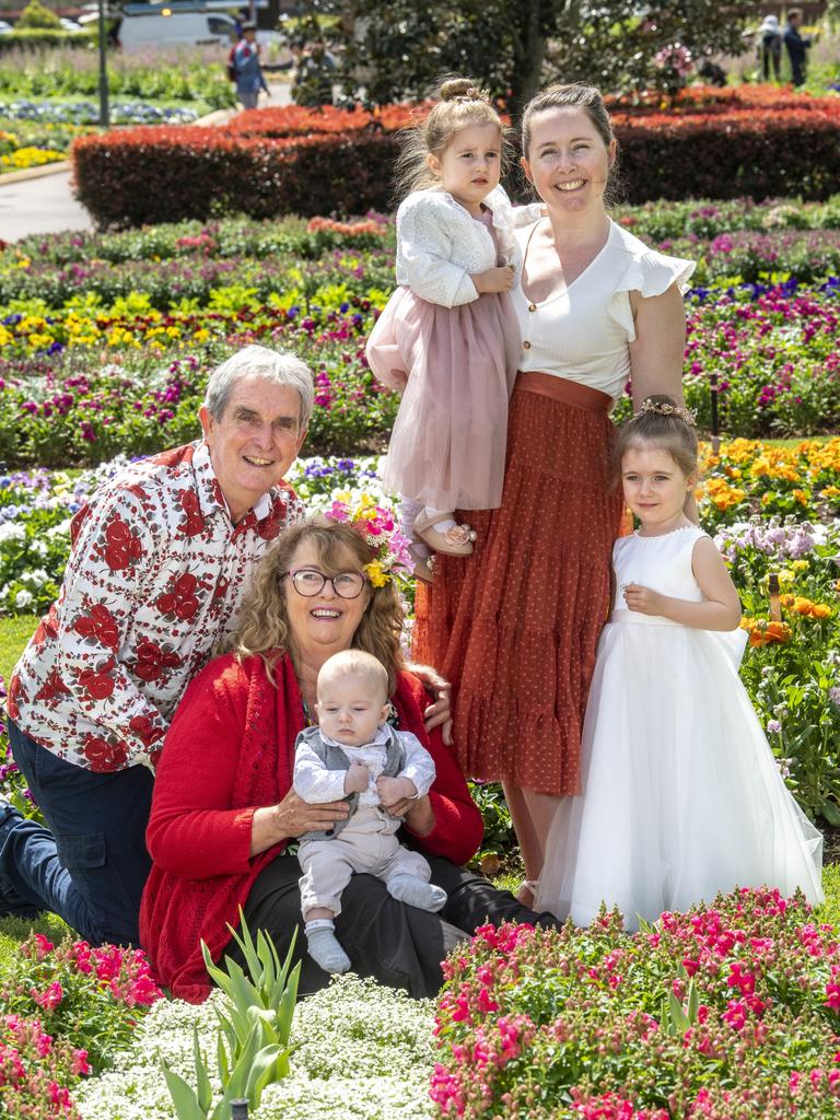 The Hodgkinson family have been making the pilgrimage to Toowoomba for 40 years (from left) Paul Hodgkinson, Helen Hodgkinson, Fletcher Oliveri, Everlyn Oliveri, Elizabeth Oliveri and Amelia Oliveri gather in the Botanic Gardens in Queens Park for the 2021 Carnival of Flowers. Picture: Nev Madsen