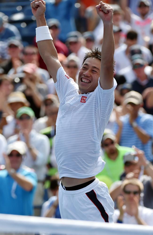 TOPSHOTS Kei Nishikori of Japan celebrates his win over Novak Djokovic of Serbia during their 2014 US Open men's semifinal singles match at the USTA Billie Jean King National Tennis Center September 6, 2014 in New York. AFP PHOTO/Stan HONDA