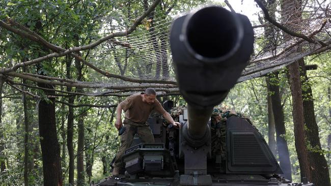 A Ukrainian serviceman of the 43rd Artillery Brigade works on a 155 mm self-propelled howitzer Panzerhaubitze 2000 towards Russian positions at a front line near Bakhmut, Donetsk region on June 15.