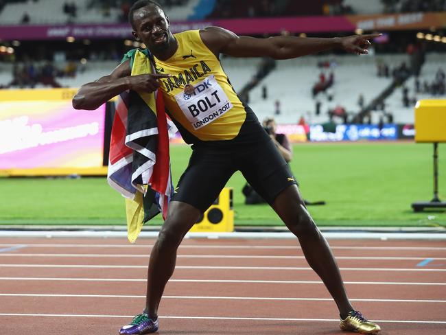 Usain Bolt of Jamaica celebrates during a lap of honour following.