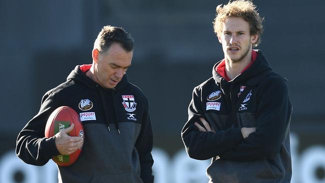 Saints coach Alan Richardson talks to defender Jimmy Webster.