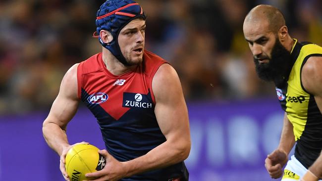 Angus Brayshaw of the Demons (left) and Bachar Houli of the Tigers contest the Round 20 AFL match between the Melbourne Demons and the Richmond Tigers at the MCG in Melbourne, Saturday, August 3, 2019.  (AAP Image/Julian Smith) NO ARCHIVING, EDITORIAL USE ONLY