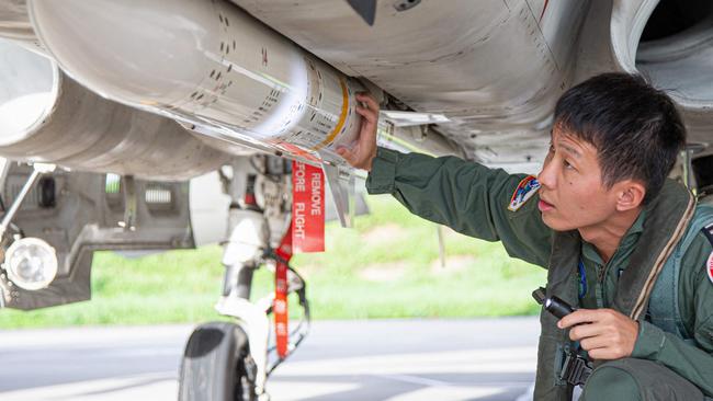 A Taiwanese Air Force pilot inspects ordnance at an undisclosed military base.