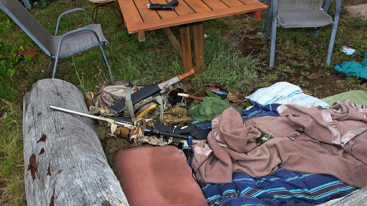 Nathaniel Train’s rifle where he was fatally shot by SERT officers during his ‘last stand’. Constable Arnold's pistol can be seen on the table. Picture: Supplied