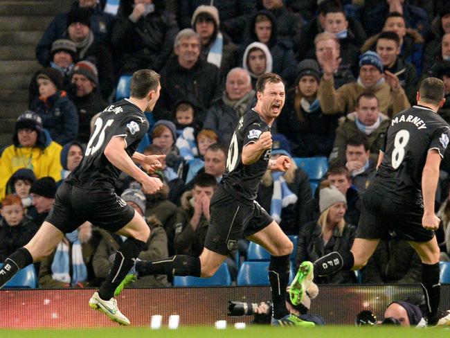 Burnley's English striker Ashley Barnes (C) celebrates scoring their second goal.