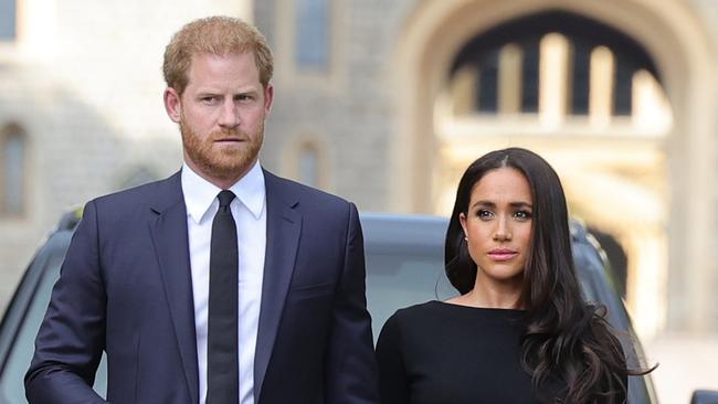 WINDSOR, ENGLAND - SEPTEMBER 10: Prince Harry, Duke of Sussex, and Meghan, Duchess of Sussex arrive on the long Walk at Windsor Castle arrive to view flowers and tributes to HM Queen Elizabeth on September 10, 2022 in Windsor, England. Crowds have gathered and tributes left at the gates of Windsor Castle to Queen Elizabeth II, who died at Balmoral Castle on 8 September, 2022. (Photo by Chris Jackson/Getty Images)