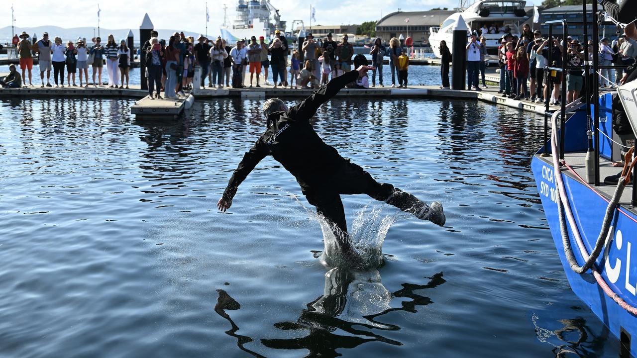 HOBART, AUSTRALIA – DECEMBER 28: Christian Beck, Skipper of LawConnect is tossed by the crew into the water at Constitution Dock after winning line honours the 2023 Sydney to Hobart, on December 28, 2023 in Hobart, Australia. (Photo by Steve Bell/Getty Images)